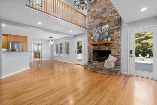 red oak floors in a living room by fireplace